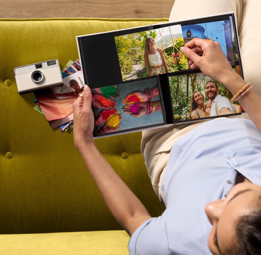 Snapfish glossy photo prints in various sizes arranged on a table